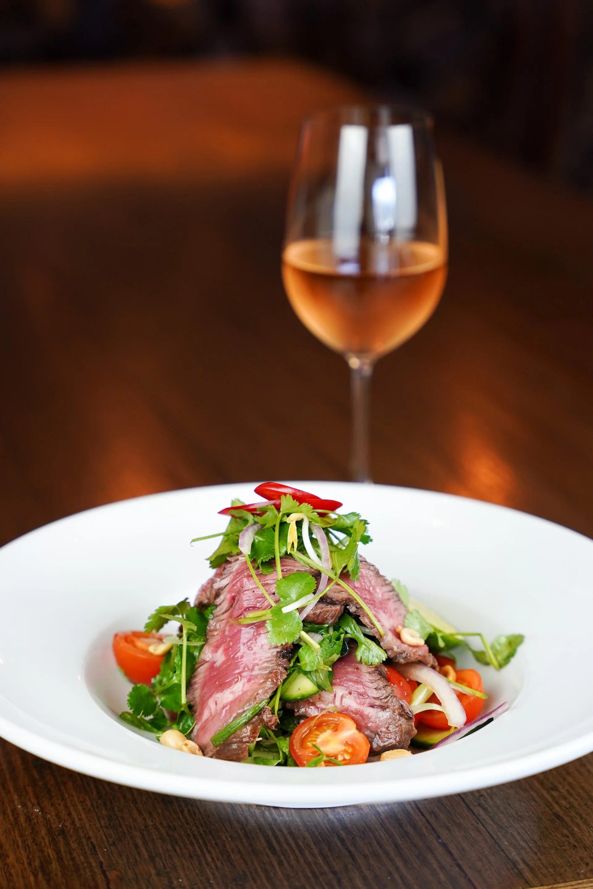 Thai beef salad with a glass of rose at Waterbar & Grill Steakhouse, Cairns