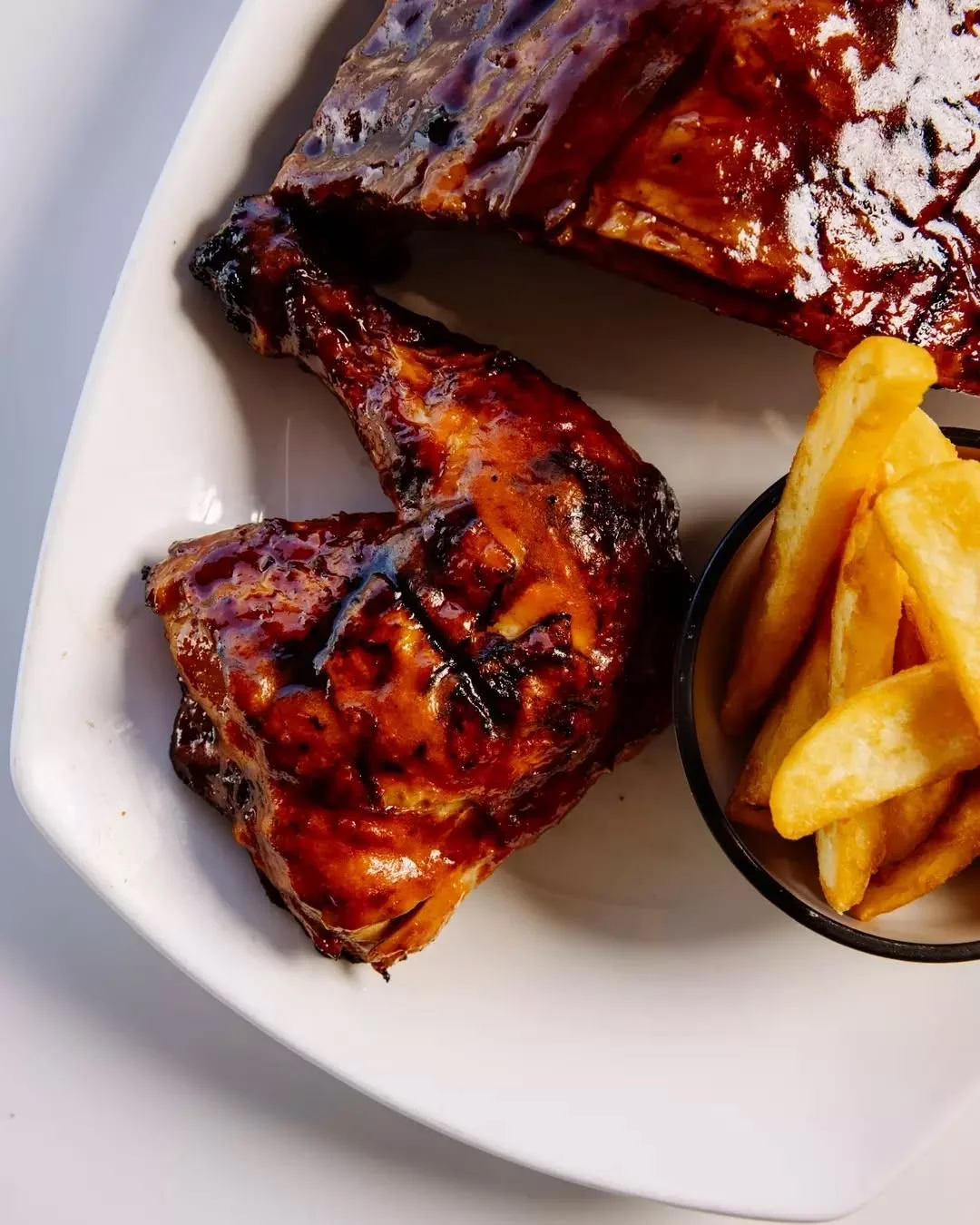 Barbecue ribs and chicken with chips at Waterbar & Grill Steakhouse, Cairns