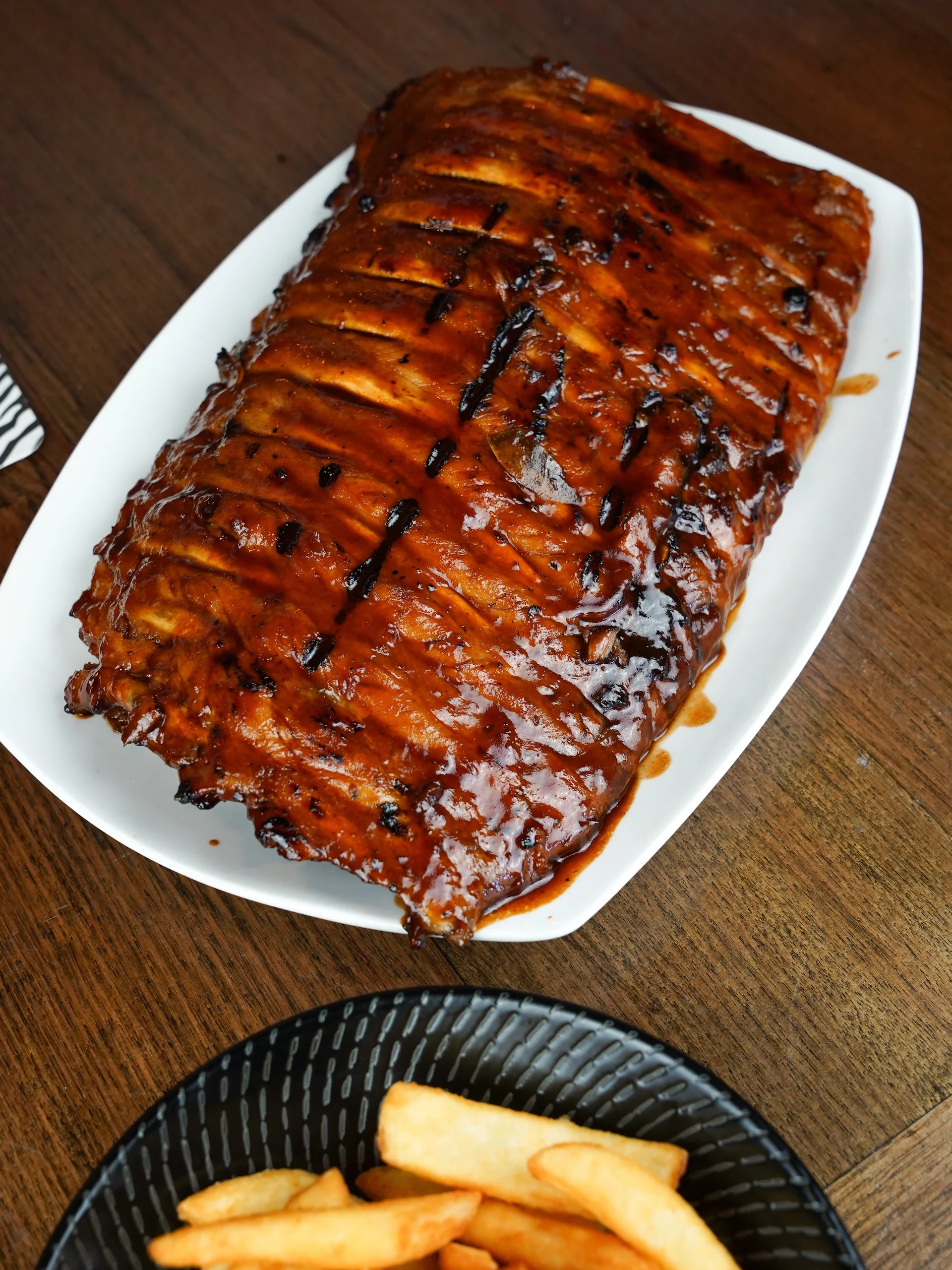 Full rack of barbecue pork ribs with chips at Waterbar & Grill Steakhouse, Cairns