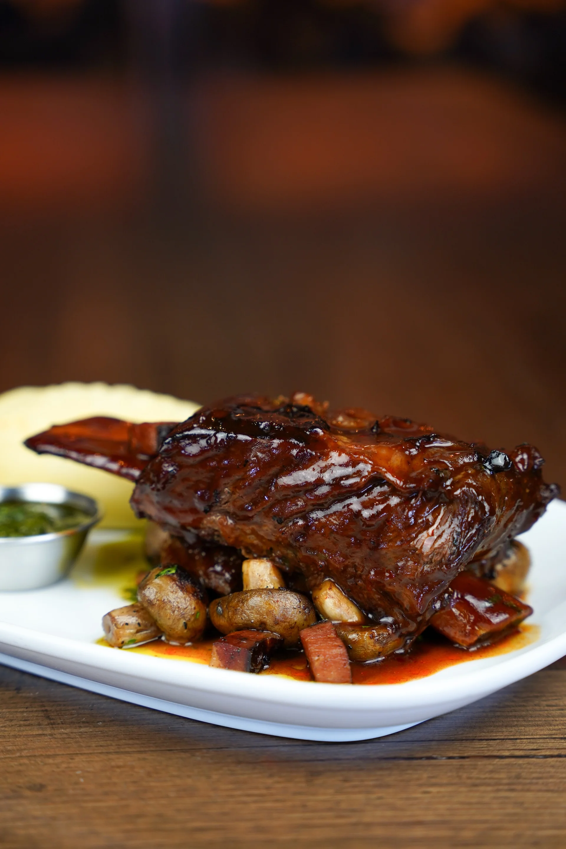 Slow-braised lamb shank with mushrooms and mash at Waterbar & Grill Steakhouse, Cairns