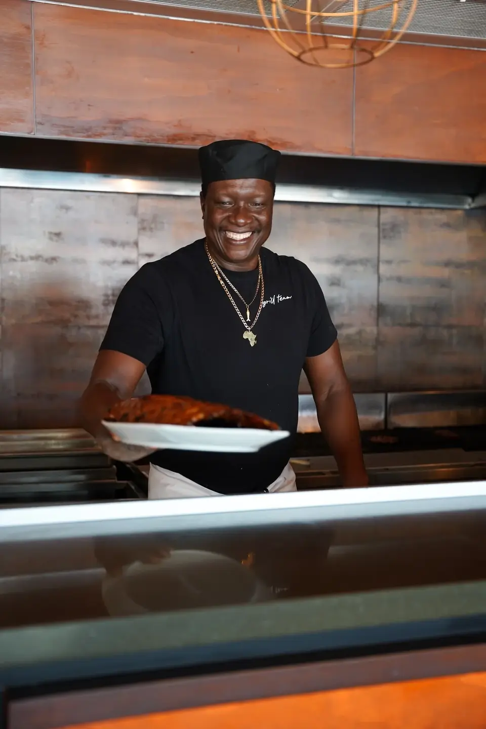 Chef at the grill at Waterbar & Grill Steakhouse